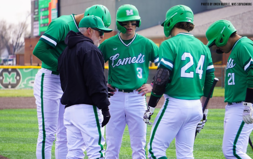 team huddled around coach