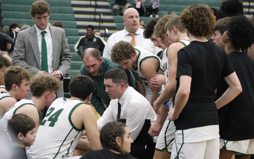 boys basketball team huddle