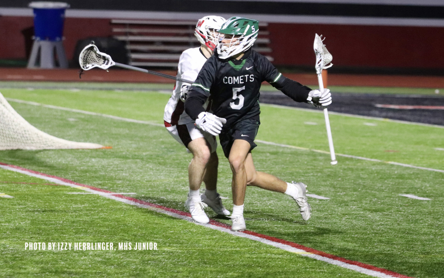 comets with the ball, opponent on their tail