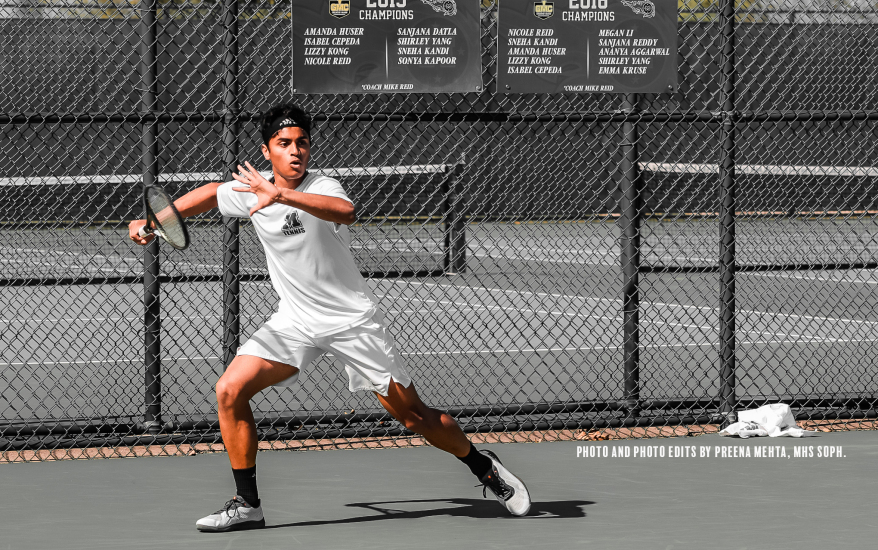 Boy playing tennis