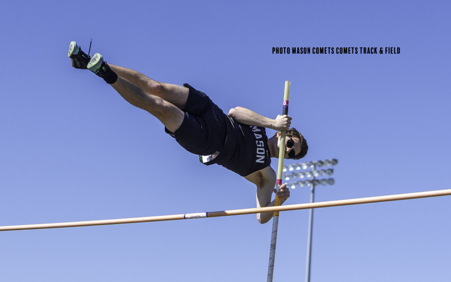 boy pole vaulting