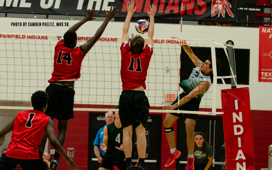 boys playing volleyball