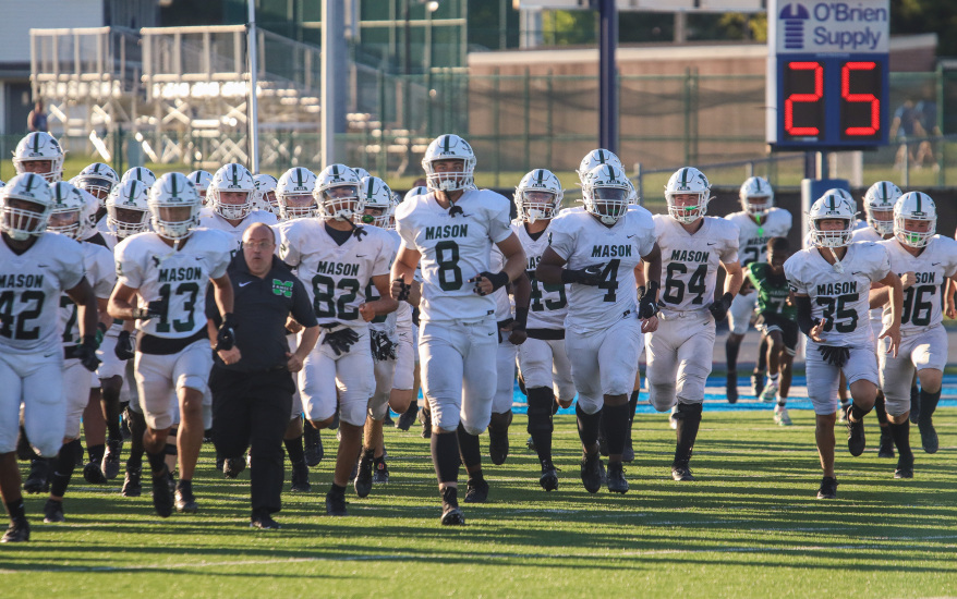 Football players marching on to the field