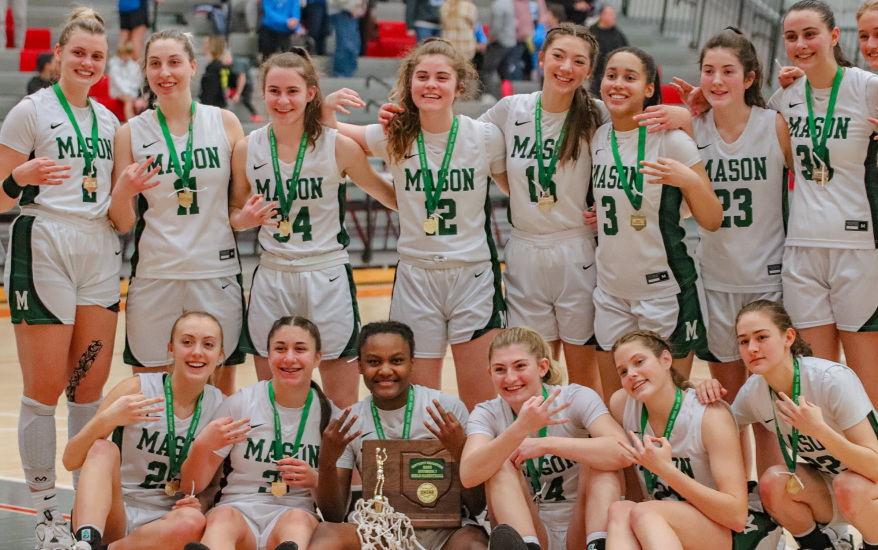 girls basketball team with medals