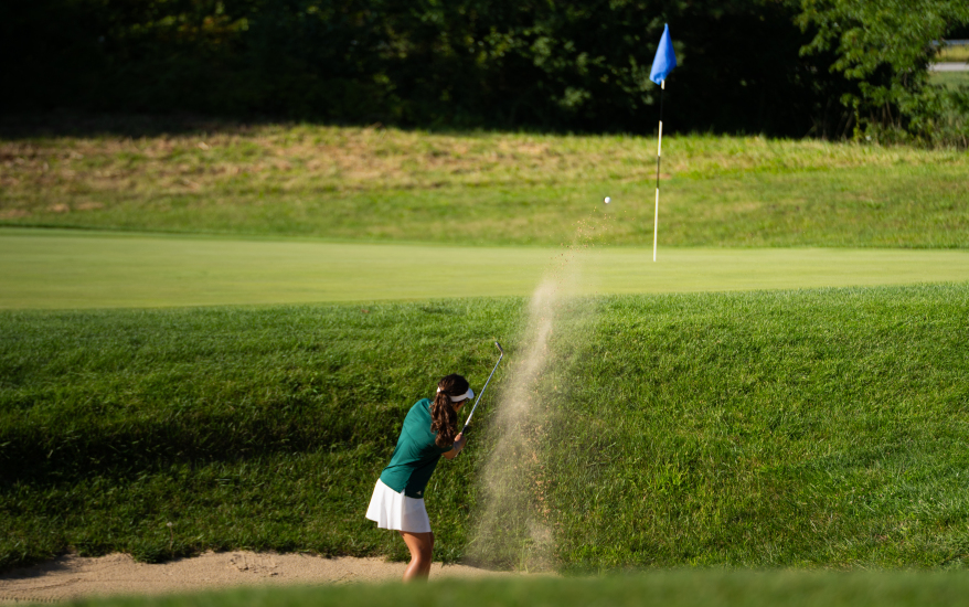girl playing golf