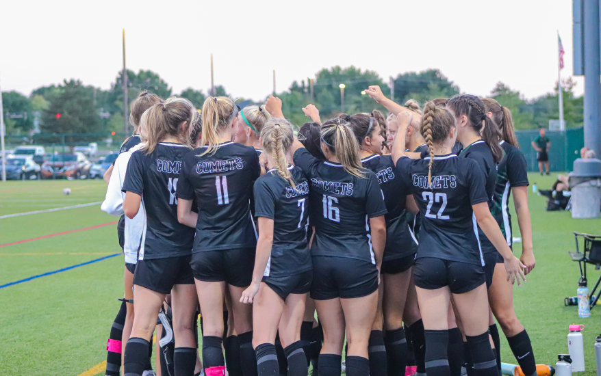 Team gathered in a huddle