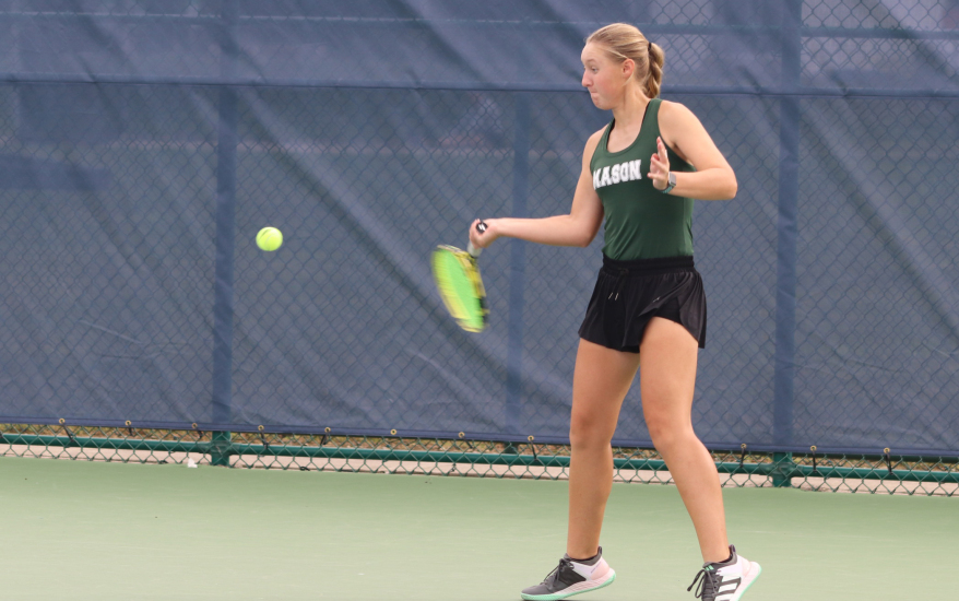 Mason girls tennis player swings back at a ball