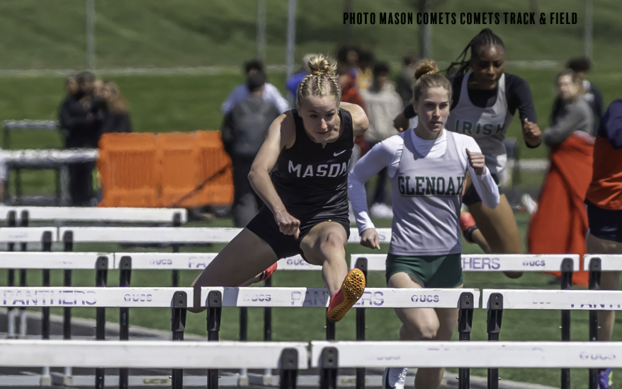 girl jumping over hurdle