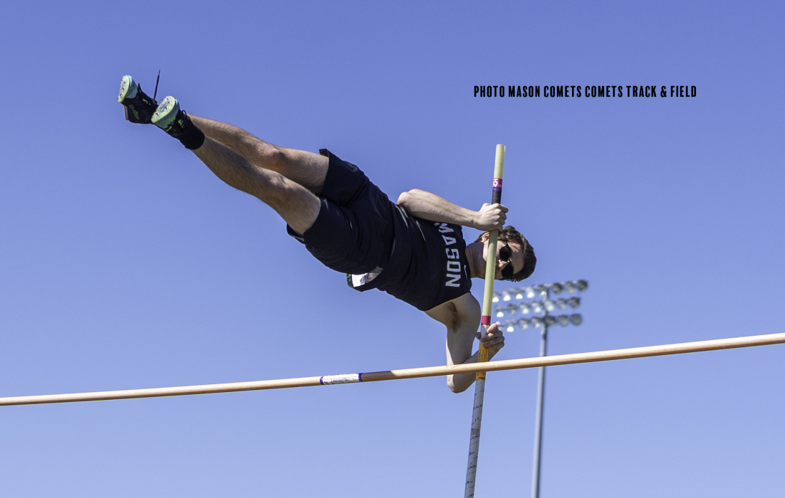 boy pole vaulting