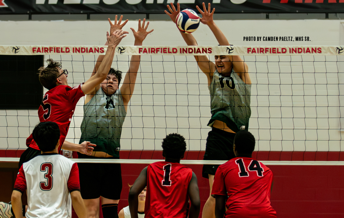 boys playing volleyball